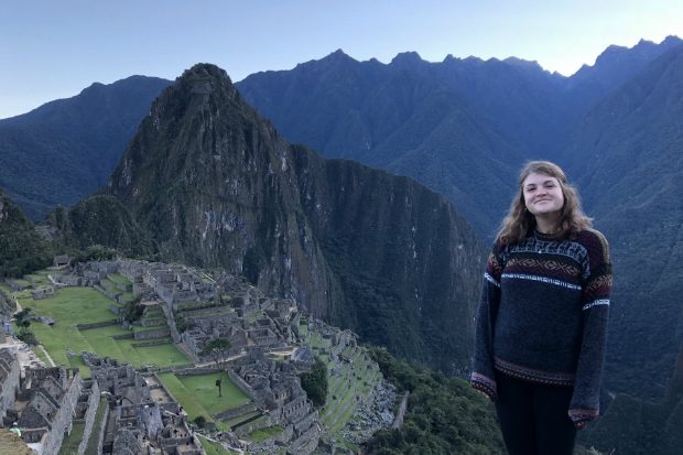 Mary standing at the top of mountain.