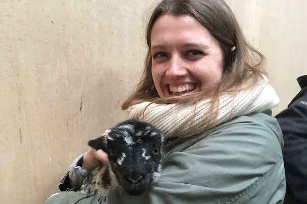 Emma holding a baby lamb