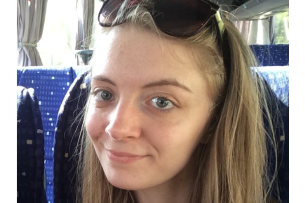 Isobel sitting on the train.