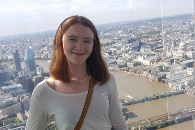 Laura overlooking London from a high rise building.